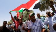 FILE PHOTO: Members of Sudan's alliance of opposition and protest groups chant slogans outside Sudan's Central Bank during the second day of a strike, as tensions mounted with the country's military rulers over the transition to democracy, in Khartoum, Su