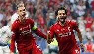 Liverpool's Mohamed Salah celebrates scoring their first goal from the penalty spot with Jordan Henderson REUTERS/Susana Vera