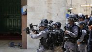 Israeli security forces aim tear gas at Palestinians at the al-Aqsa Mosque compound, in the Old City of Jerusalem on June 2, 2019.  AFP / Ahmad GHARABLI