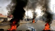 Sudanese protesters use burning tyres to erect a barricade on a street, demanding that the country's Transitional Military Council hand over power to civilians, in Khartoum, Sudan June 3, 2019. REUTERS/Stringer TPX IMAGES OF THE DAY