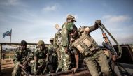 Democratic Republic of the Congo armed forces soldiers FARDC prepare to escort health workers attached to ebola response programs on May 18, 2019 in Butembo, north of Kivu. AFP/John Wessels