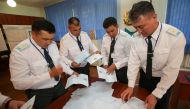 Officers, who are members of a local election committee, open a ballot box after polls closed due to all servicemen having voted, at the unit of Kazakhstan's Republican Guards during presidential election in Almaty, Kazakhstan, June 9, 2019. REUTERS/Pavel