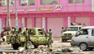 Sudanese soldiers stand guard a street in Khartoum on June 9, 2019. Sudanese police fired tear gas Sunday at protesters taking part in the first day of a civil disobedience campaign, called in the wake of a deadly crackdown on demonstrators. AFP 
