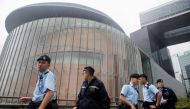 Policemen patrol outside the Legislative Council building ahead of tomorrow's hearing on the extradition bill in Hong Kong, China, June 11, 2019. REUTERS/Thomas Peter