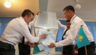 Officers, who are members of a local election committee, open a ballot box after polls closed due to all servicemen having voted, at the unit of Kazakhstan's Republican Guards during the presidential election in Almaty, Kazakhstan, June 9, 2019. REUTERS/P