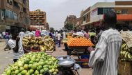 A view of produce stalls and carts at a market in the Sudanese capital Khartoum. / AFP 