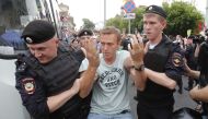 Policemen detain Russian opposition leader Alexei Navalny during a rally in support of investigative journalist Ivan Golunov, who was detained by police, accused of drug offences and later freed from house arrest, in Moscow, Russia June 12, 2019. Reuters/