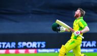 Australia's David Warner celebrates after scoring a century (100 runs) during the 2019 Cricket World Cup group stage match between Australia and Pakistan at The County Ground in Taunton, southwest England, on June 12, 2019.  AFP / Saeed Khan 
