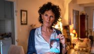 Christine Morin poses at her home in Narbonne on June 5, 2019, with a photograph of her son Thomas who joined Islamic State (ISIS) in 2015 at the age of 30 and was killed in the coalition bombing of Barghouz early in 2019. Christine Morin is calling for t