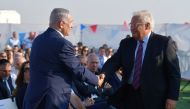 Israeli Prime Minister Benjamin Netanyahu (L) and U.S. Ambassador to Israel David Friedman (R) attend a groundbreaking of a Jewish settlement named 