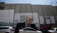 A mural depicting US President Donald Trump is seen on a section of the Israeli barrier in Bethlehem, in the Israeli-occupied West Bank June 23, 2019. Reuters/Mussa Qawasma 