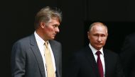 Russian President Vladimir Putin (R) and Russian Presidential Spokesman Dmitry Peskov. Sefa Karacan - Anadolu 