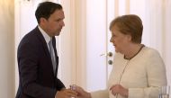 German Chancellor Angela Merkel receives water as she was seen shaking meeting President Frank-Walter Steinmeier in Berlin, Germany, June 27, 2019, her second shaking bout within two weeks. REUTERS/Reuters TV