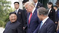 U.S. President Donald Trump, North Korean leader Kim Jong Un and South Korean President Moon Jae-in leave after a meeting at the demilitarized zone separating the two Koreas, in Panmunjom, South Korea, June 30, 2019. REUTERS/Kevin Lamarque