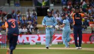 England's Jason Roy (C) and teammate Jonny Bairstow (2R) look on as India's Yuzvendra Chahal (L) fields the ball towards India's Hardik Pandya (R) during the 2019 Cricket World Cup group stage match between England and India at Edgbaston in Birmingham, ce