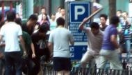This file image taken on July 8, 2009 shows an AFP TV grab showing a mob of Han Chinese attacking a lone Muslim Uighur man along a street in Urumqi, China's farwest Xinjiang region. AFP TV / Sam Beattie
