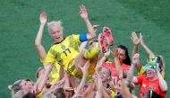 Sweden's Caroline Seger celebrates after the match with team mates REUTERS/Jean-Paul Pelissier