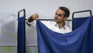 New Democracy leader Kyriakos Mitsotakis stands in a polling booth prior to casting his vote during general elections at a polling station in Athens, Greece on July 7, 2019.  AFP / Aris Messinis 