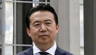 FILE PHOTO: INTERPOL President Meng Hongwei poses during a visit to the headquarters of International Police Organisation in Lyon, France, May 8, 2018. Picture taken May 8, 2018. Jeff Pachoud/Pool via Reuters/File Photo