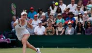 US player Alison Riske returns against Australia's Ashleigh Barty during their women's singles fourth round match on the seventh day of the 2019 Wimbledon Championships at The All England Lawn Tennis Club in Wimbledon, southwest London, on July 8, 2019. (