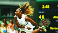 US player Serena Williams serves against US player Alison Riske during their women's singles quarter-final match on day eight of the 2019 Wimbledon Championships at The All England Lawn Tennis Club in Wimbledon, southwest London, on July 9, 2019.  AFP / D