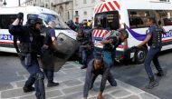 Riot police officers clash with undocumented migrants outside the Pantheon in Paris, France, July 12, 2019. Reuters/Charles Platiau