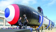 French President Emmanuel Macron (L) attends the official launch ceremony of the new French nuclear submarine 