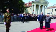 Lithuania's president, Gitanas Nauseda and his predecessor Dalia Grybauskaite stand on the red carpet during the handover ceremony at the presidential palace on July 12, 2019 in Vilnius. / AFP / Petras Malukas
