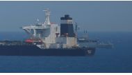 A British Royal Navy patrol vessel guards the oil supertanker Grace 1, that's on suspicion of carrying Iranian crude oil to Syria, as it sits anchored in waters of the British overseas territory of Gibraltar, historically claimed by Spain, July 4, 2019. R