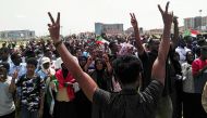 Sudanese protesters chant slogans and wave national flags as they march in the capital Khartoum's Green Square on July 18, 2019, as they honour comrades killed in the months-long protest movement that has rocked the country. AFP