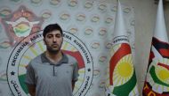 This handout photograph released by the Kurdistan Region Counterterrorism Unit on July 20, 2019, shows 27-year-old Mazloum Dag, a Kurdish man from Turkey who was identified as the suspected shooter in the murder of a Turkish diplomat, standing at an undis