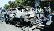 Afghan security officials inspect the scene of a bomb blast near the University of Afghanistan in Kabul, Afghanistan on July 19, 2019.  (Haroon Sabawoon/Anadolu Agency)
