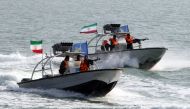 In this file photo taken on July 02, 2012 Iranian Revolutionary Guards drive speedboats during a ceremony to commemorate the 24th anniversary of the downing of Iran Air flight 655 by the US navy, at the port of Bandar Abbas. (AFP / Atta KENARE)