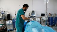 A wounded migrant receives medical care after an air strike hit a detention center for mainly African migrants in Tajoura, in Tripoli Central Hospital, Libya July 3, 2019. Reuters/Ismail Zitouny
