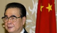 File photo of Chairman of the National Congress of the People's Republic of China Li Peng stands next to a Chinese flag in Canberra's Parliament House in Australia September 16, 2002. REUTERS/David Gray/File Photo
