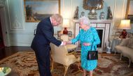 Britain's Queen Elizabeth II welcomes newly elected leader of the Conservative party, Boris Johnson during an audience in Buckingham Palace, London on July 24, 2019, where she invited him to become Prime Minister and form a new government. (AFP / POOL / V