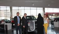 Al-Attiya Motors and QSports representatives Aya Kassab, Head of Business Development Unit and Qazi Yousri, Media Manager, hand over the keys of the Kia Telluride to the winner of the SEC Raffle Draw, Samah Mohammed S M, in a ceremony held at the Al Sadd 