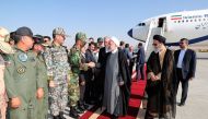 A handout picture shows Iran's President Hassan Rouhani(C) greeted on his arrival to Tabriz airport in the northwestern East-Azerbaijan province on August 1. (AFP / Iranian Presidency)