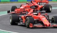 Ferrari's German driver Sebastian Vettel steers his car in front of Ferrari's Monegasque driver Charles Leclerc during the second practice session of the Formula One Hungarian Grand Prix at the Hungaroring circuit in Mogyorod near Budapest, Hungary, on Au
