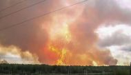 This screen grab from a video made on August 5, 2019 shows explosions at an ammunition depot near the town of Achinsk in the Krasnoyarsk region. / AFP / OSA TV / - 
