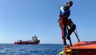 A member of the French NGOs SOS Mediterranee and Medecins sans Frontieres (MSF) new boat Ocean Viking takes part in a team exercise to get ready for a rescue situation at sea with a 