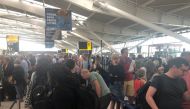 Passengers wait in long queues at Heathrow Airport as IT problems caused flight delays in London, Britain, August 7, 2019 in this picture obtained from social media. Paul Trickett 