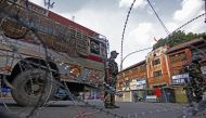 Indian security personnel patrol on a street during a curfew in Srinagar, Kashmir, India on August 06, 2019. Faisal Khan - Anadolu 