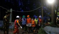 Rescue workers bring a body out of the site of the landslide in Mottama, Mon state, Myanmar, August 10, 2019. REUTERS/Ann Wang