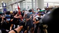 Riot police use pepper spray to disperse anti-extradition bill protesters during a mass demonstration after a woman was shot in the eye, at the Hong Kong international airport, in Hong Kong, China, August 13, 2019. (REUTERS/Tyrone Siu)