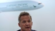 This file photo taken on August 16, 2017 shows Cathay Pacific's chief executive officer Rupert Hogg speaking during a press conference on the company's half-year results in Hong Kong. / AFP / Anthony WALLACE 