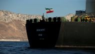 The Iranian flag flies on board the Iranian oil tanker Adrian Darya 1, formerly named Grace 1, as it sits anchored after the Supreme Court of the British territory lifted its detention order, in the Strait of Gibraltar, Spain, August 18, 2019. REUTERS/Jon