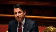 Italian Prime Minister Giuseppe Conte looks on as he delivers a speech at the Italian Senate, in Rome, on August 20, 2019, as the country faces a political crisis. / AFP / Andreas SOLARO 