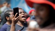 A woman shouts out against the recent surge in violent protests in Indonesia's eastern Papua province, during a rally in Denpasar on Indonesia’s resort island of Bali on August 22, 2019.  AFP / SONNY TUMBELAKA