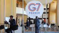 People work the advanced press centre in the Casino of Biarritz, south-west France on August 24, 2019, on the first day of the annual G7 Summit attended by the leaders of the world's seven richest democracies, Britain, Canada, France, Germany, Italy, Japa